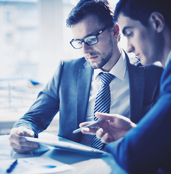 Two colleagues looking at a tablet together